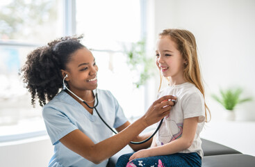 Obraz premium Doctor at working with child girl patient in a rehab clinic
