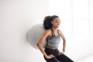 attractive black american woman training at home