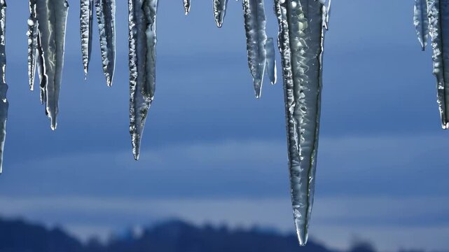 Elegant Silver Abstract Icicles Against a Deep Blue Twilight Sky: A Festive Winter Artwork Template