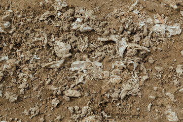 Polluted Soil Surface with Litter and Waste Showing Environmental Damage and Land Preparation...