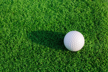 White Golf Ball on Lush Green Artificial Turf Surface