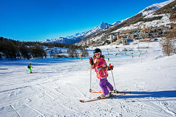 happy little skier on the slope at the Italian resort in the Alps. The best School holidays