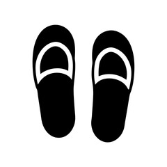Pair of black flip flops or slippers isolated on a white background