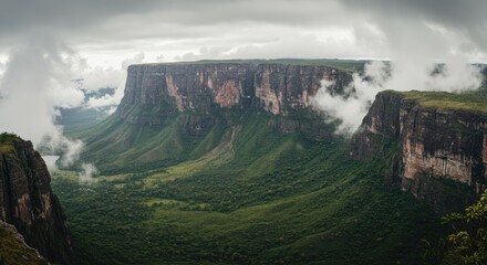 Dramatic Mountain Landscape with Clouds and Lush Green Valley