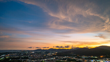 Aerial view of Khao Rang Viewpoint at dusk an important landmark in Phuket Town.Khao Rang Viewpoint offers a panoramic view and the twinkling lights of Phuket Town at night, which are beautiful.