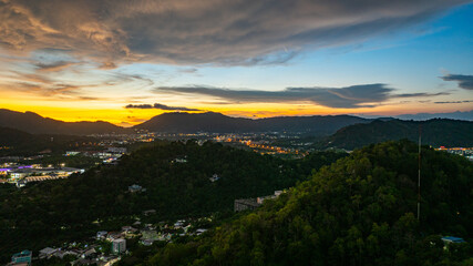 Aerial view of Khao Rang Viewpoint at dusk an important landmark in Phuket Town.Khao Rang Viewpoint offers a panoramic view and the twinkling lights of Phuket Town at night, which are beautiful.