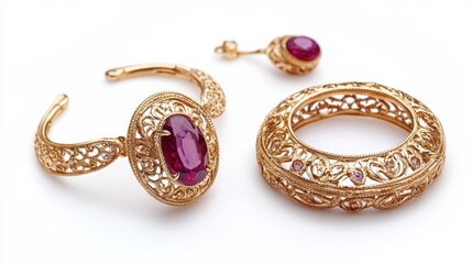Vintage gold jewelry set with delicate filigree designs and oval rubies on earrings, necklace, and matching ring, isolate on white background