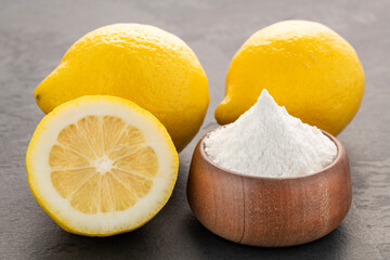Bowl with baking soda and sliced ​​lemons - Citrus Limon