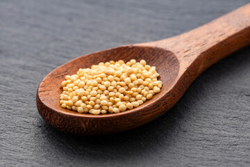 Raw organic amaranth seeds in a spoon - Amaranthus