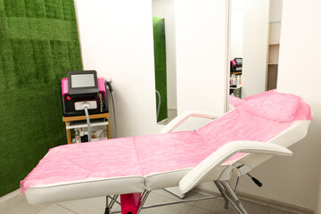 Depilation procedure. Laser hair removal machine and medical couch in beauty salon