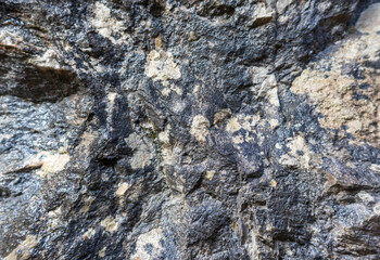 the walls of a stone gorge in a mountainous area, the structure of a geological section