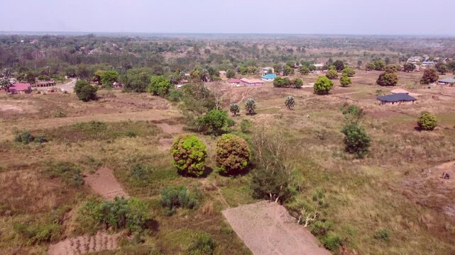 Aerial flight over the countryside of rural Northern Uganda near the South Sudan border.