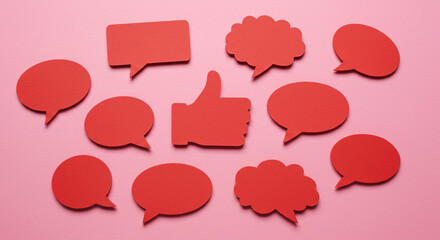 Red speech bubbles thumbs up on pink positive feedback communication social media online reviews