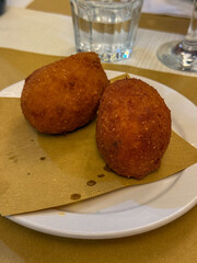 2 ready to eat Arancini in a plate