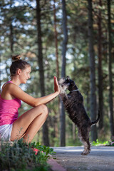 Girls and dogs having fun in nature