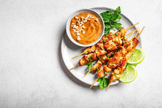 Grilled Chicken satay skewers and peanut spicy sauce