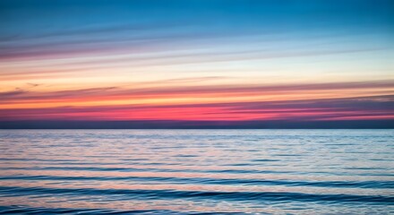 Fototapeta premium Ocean horizon glowing with vibrant colors.jpg