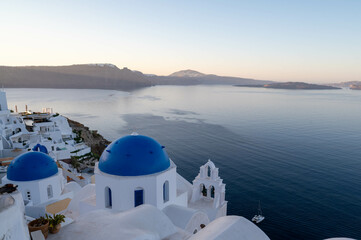 The view of Oia village at sunrise, early morning