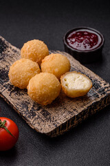 Cheese fried balls or croquettes with potatoes or rice
