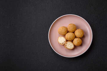 Cheese fried balls or croquettes with potatoes or rice