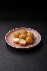 Cheese fried balls or croquettes with potatoes or rice