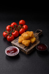 Fried mozzarella or brie cheese with cranberry or raspberry sauce