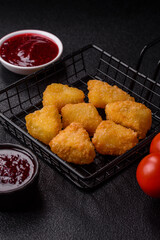 Fried mozzarella or brie cheese with cranberry or raspberry sauce