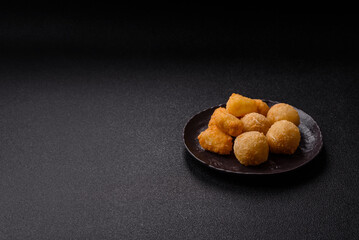 Fried mozzarella or brie cheese with cranberry or raspberry sauce