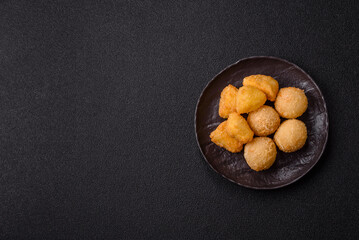 Fried mozzarella or brie cheese with cranberry or raspberry sauce