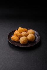 Fried mozzarella or brie cheese with cranberry or raspberry sauce