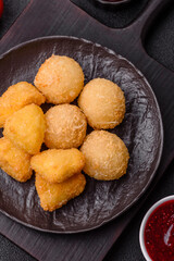Fried mozzarella or brie cheese with cranberry or raspberry sauce