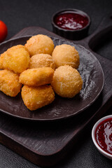 Fried mozzarella or brie cheese with cranberry or raspberry sauce