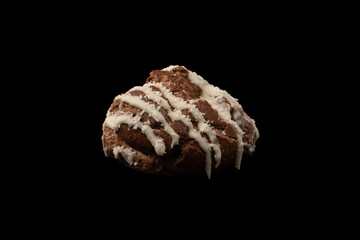 Profiteroles with coconut cream on a black background.