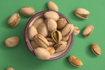 Pistachios on colorful backgrounds – healthy natural snack and vegan protein source