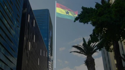 Ghanaian flag waving among glass towers and palm tree in business district, using 3D render - Powered by Adobe