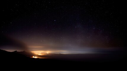 Fototapeta premium Starry night above a glowing campfire on a mountain plateau invites serene camping adventures
