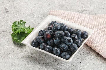Sweet ripe blueberry on the bowl