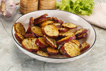Baked red batat slices with herbs