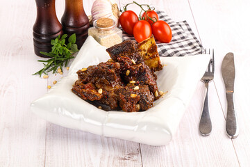 Prepared tasty beef ribs with sauce