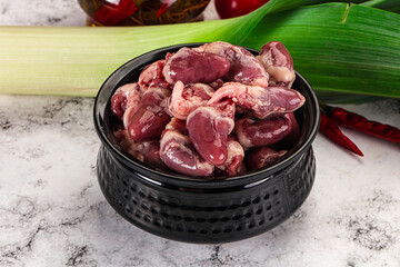 Raw chicken hearts in the bowl
