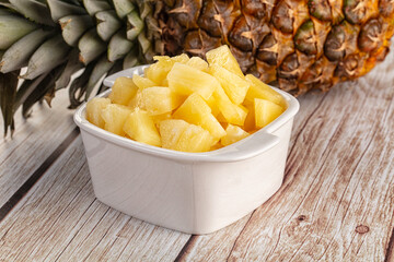 Sweet canned pineapple fruit pieces