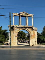 The ruins of Hadrian's triumphal arch in Athens near the road