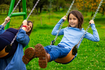 mom-and-daughter-at-swings