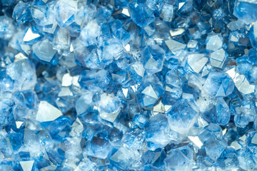 Blue Crystal Mineral Stone. Gems. Mineral crystals in the natural environment. Texture of precious and semiprecious stones. Seamless background with copy space colored shiny surface of precious stones