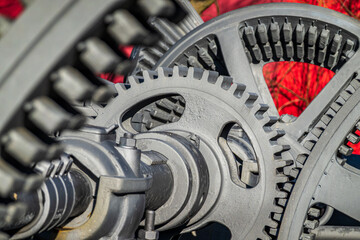Detailed view of interlocking gears working together in a mechanical system during daylight