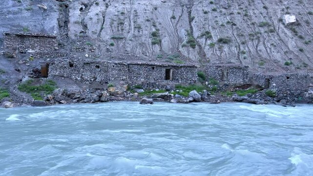 Old villages in Tajikistan. Tajikistan's road along the Zeravshan River near the Pamir highway. Old stone villages in the mountains of the Silk Road. 4К