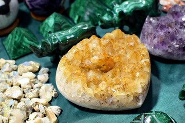 Beautiful intergrowth of citrine crystals at the stone exhibition. Natural stones amethyst, rock...