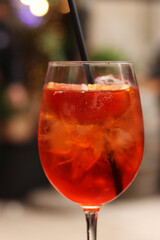 Aperol Spritz. Cold refreshing alcoholic cocktail Aperol Spritz. Cocktail close-up on a blurred...
