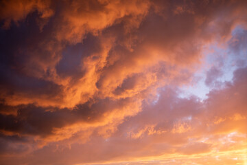 Rugged orange clouds close up sunset warm palette