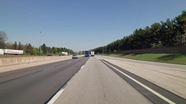 Car traffic driving on multiple lanes highway and interstate 315 and 270 belt outside Columbus, Ohio in midwest American roadway turnpike near northern city traffic by Worthington, OH